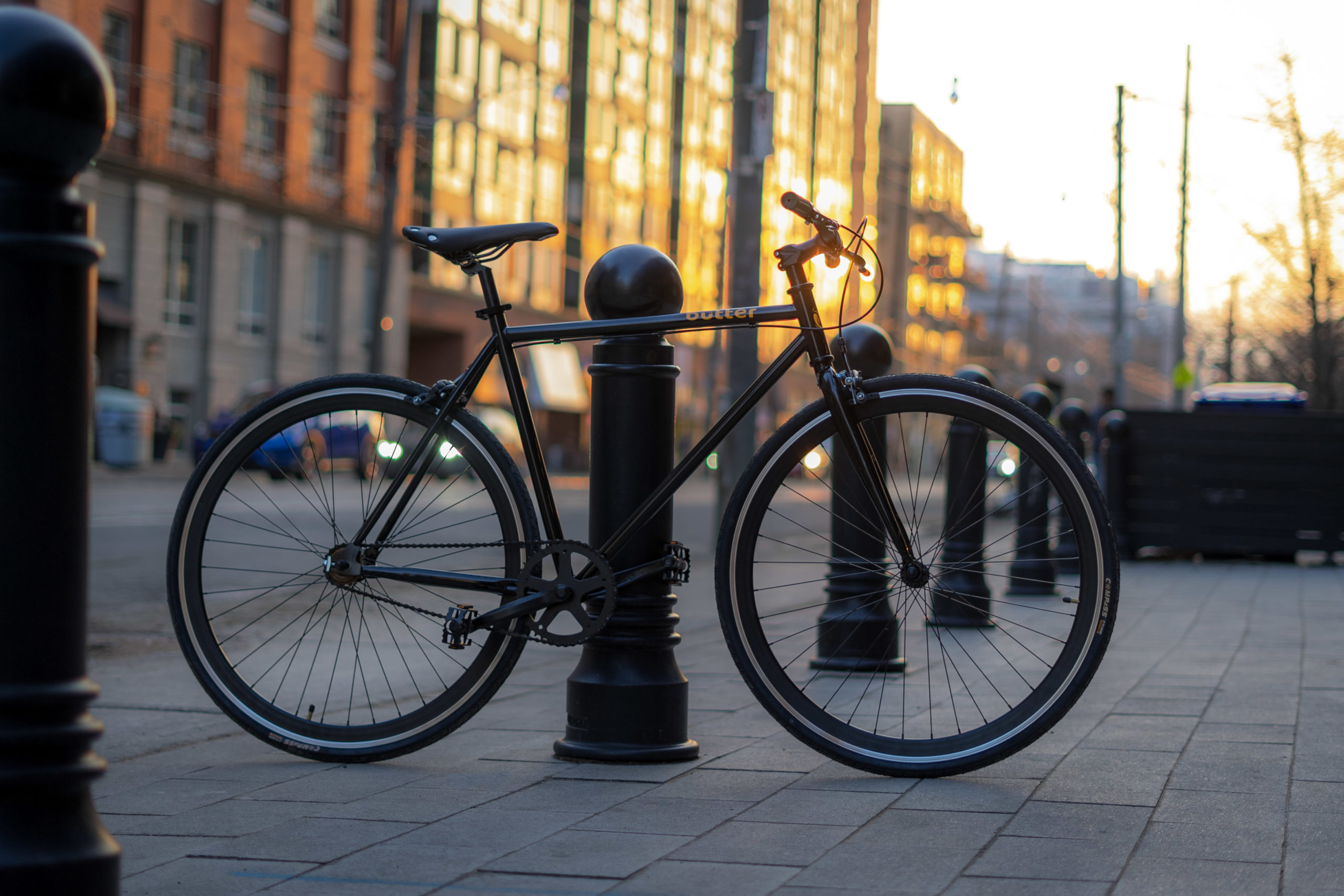 Butter bike parked on a Toronto street at golden hour
