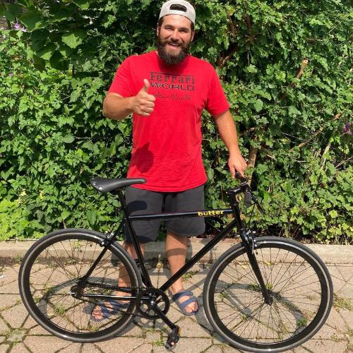 A new owner giving a thumbs up with his 53 single speed on pickup day